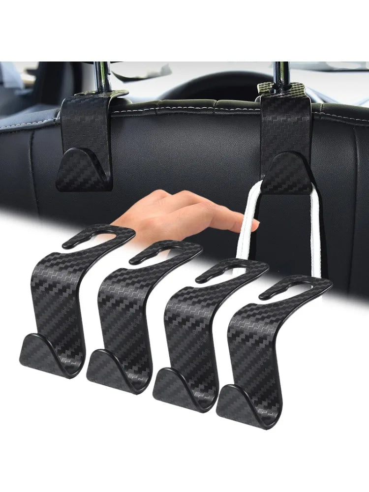 LEAP black carbon-fibre pattern car headrest hooks fitted behind a front seat