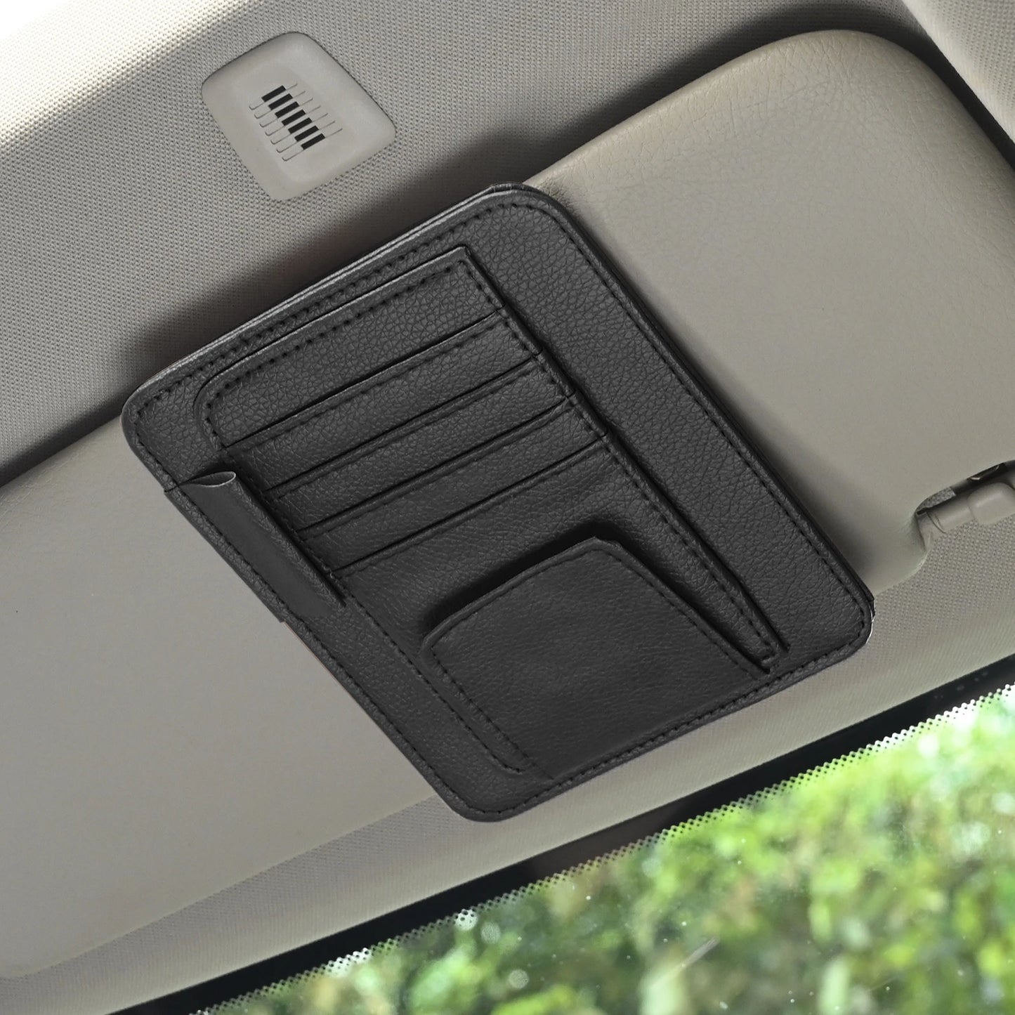LEAP black compact card and pen organiser fitted to a car sun visor