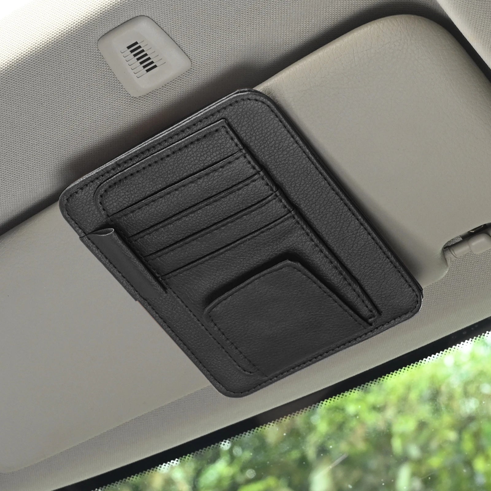 LEAP black compact card and pen organiser fitted to a car sun visor